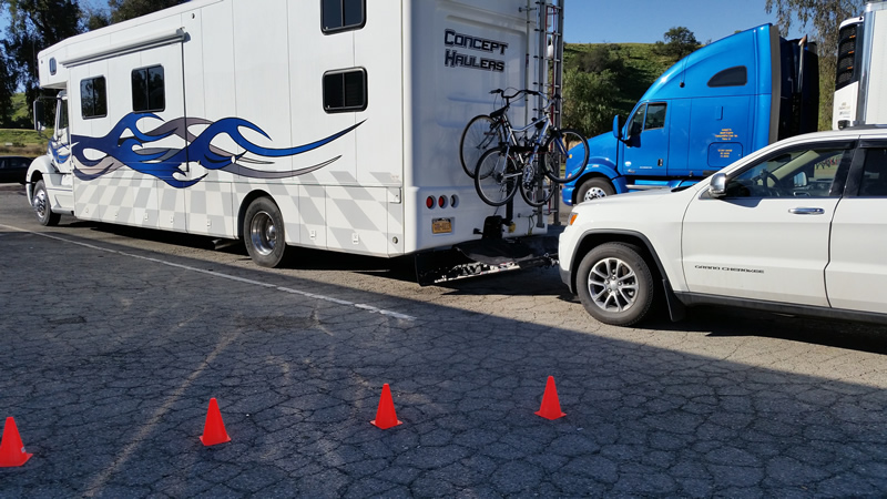 The Blue Flame with a flat tire waiting for the tire service to show up. We set up cones to reserve the spot next to us for the tire service truck.
