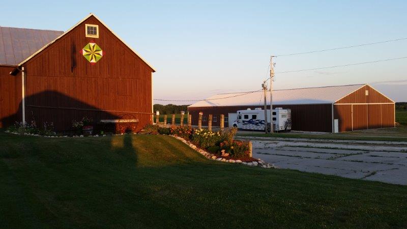 Sunset over our camping spot on the farm. Can you name that quilt block on the barn? It's the Split LeMoyne Star.
