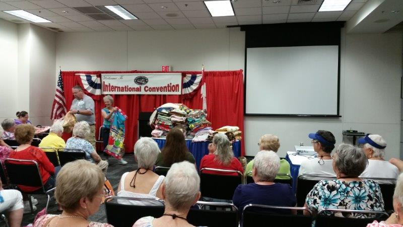 Quilters on the Road seminar. Check out that pile of charity quilts on the table! They were donated to a local hospital.