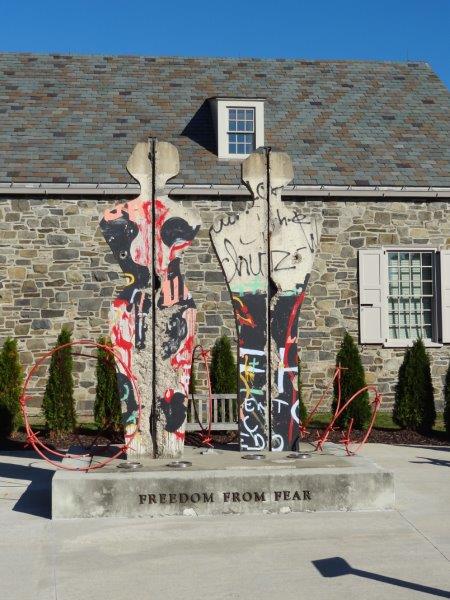 FDR was the first to state the Four Freedoms (Speech, Worship, Want, Fear). This art piece outside the Presidential Library honors those Four Freedoms and is made from pieces of the Berlin Wall.