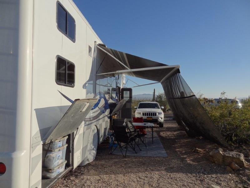 Our outdoor living room. The awning provides great shade. And the screen provides additional shade and keeps the awning from getting blown away.