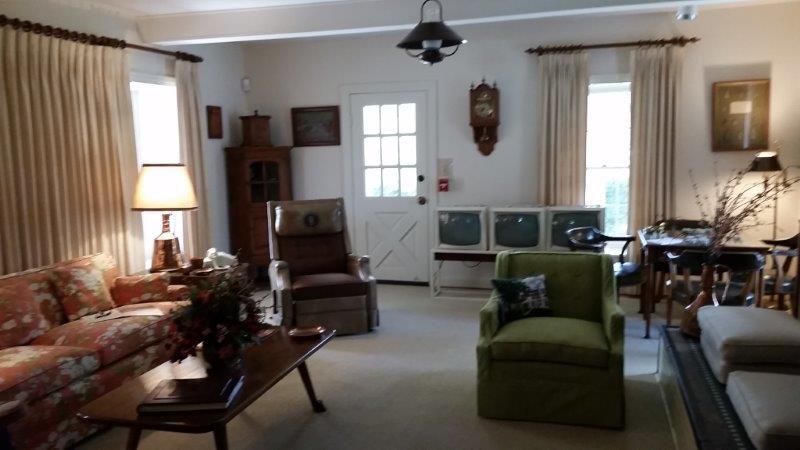 The Living Room. Note the three TVs. LBJ would have each tuned into one of the three stations that existed back then... CBS, NBC and ABC!